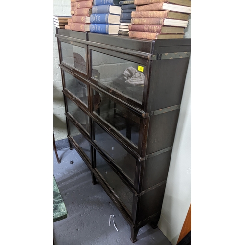 308 - Early 20th Globe Wernicke -style bookcase with eight glazed up and over doors on squared tapered 136... 