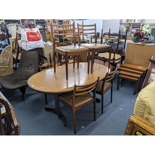 330 - A G plan teak oval draw leaf dining table and a set of six G plan dining chairs (table 206cm extende... 