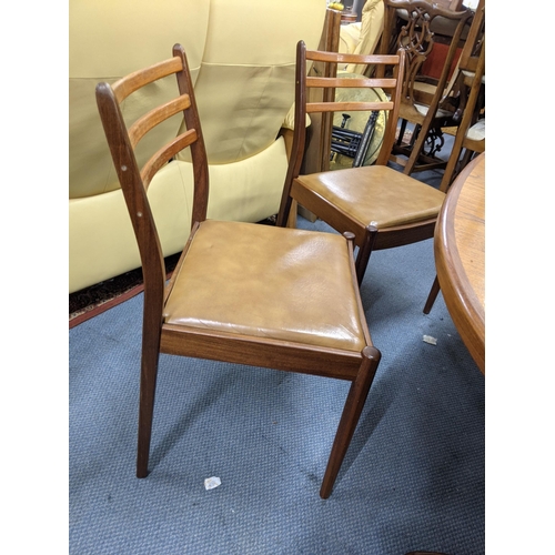 330 - A G plan teak oval draw leaf dining table and a set of six G plan dining chairs (table 206cm extende... 