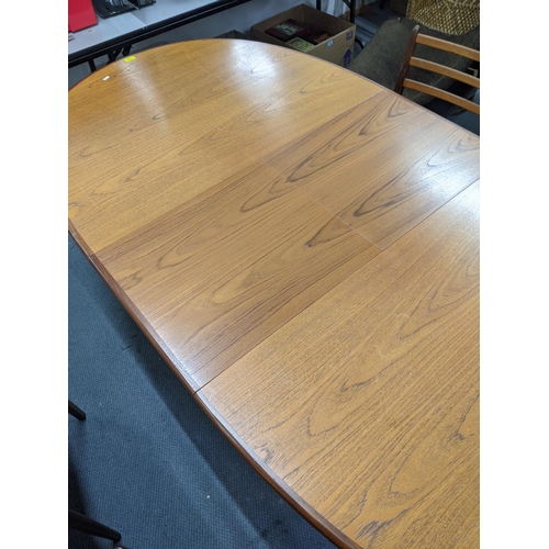 330 - A G plan teak oval draw leaf dining table and a set of six G plan dining chairs (table 206cm extende... 