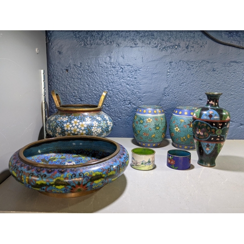 354 - Seven cloisonné items to include, a twin handled bowl, a dish two lidded pots, a vase and two rings ... 