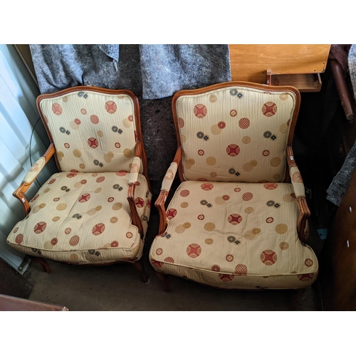 373 - A pair of modern walnut finished armchairs, upholstered in a beige fabric on cabriole legs
Location:... 