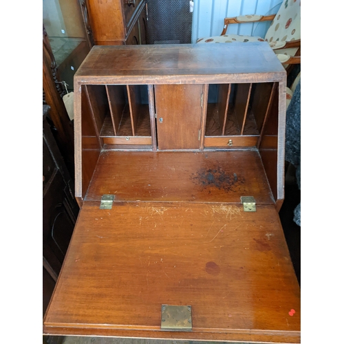 374 - An early 20th century mahogany ladies bureau with three long drawers, on bracket feet, 95cm h x 57cm... 