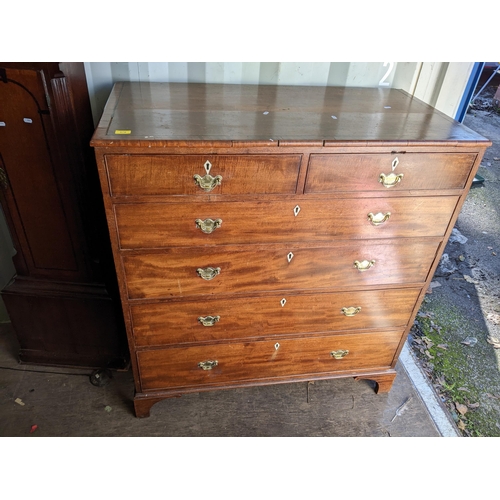 376 - A 19th century mahogany chest of two short and three long drawers , with bone escutcheons, on bracke... 