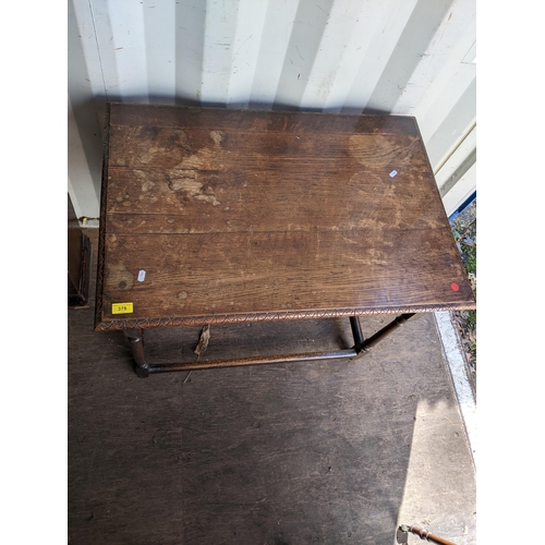 378 - A George II oak side table with a carved edge and a long drawer, on turned block legs, 70cm h x 86cm... 