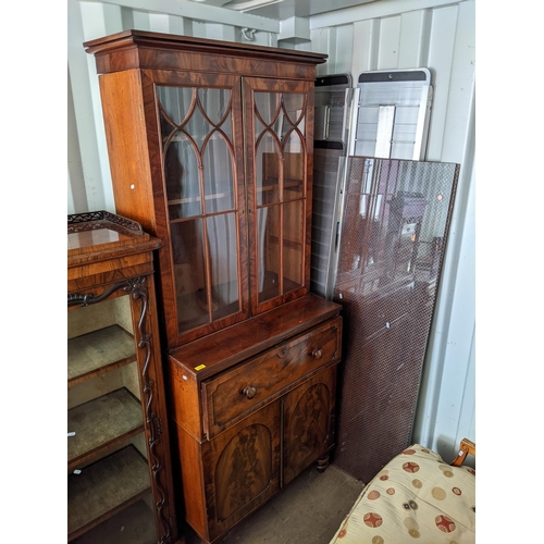 379 - A Victorian mahogany secretaire bookcase with a pair of glazed doors, over a drawer and two doors, o... 