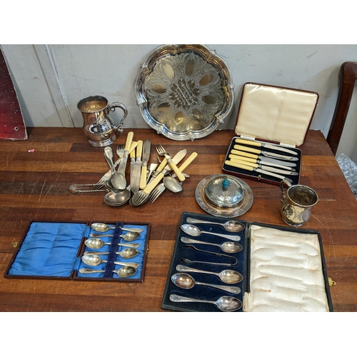 384 - Silver plate to include two sets of teaspoons, a tankard, a tray and other items
Location:G
If there... 