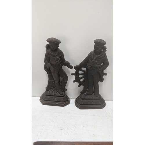 433 - A pair of Victorian cast iron door stops fashioned as sabres Location:RAB
If there is no condition r... 