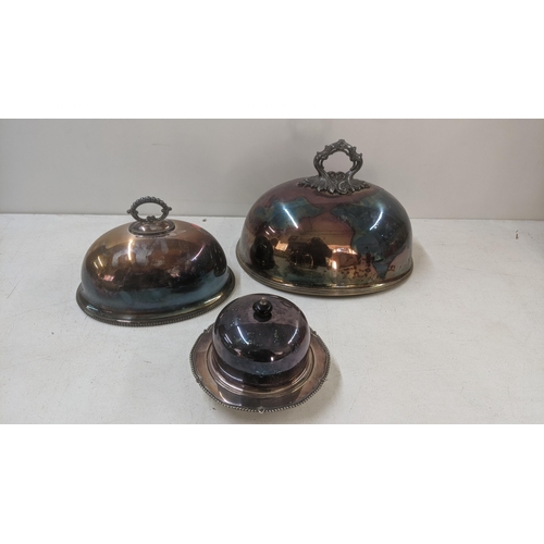 438 - Late 19th/early 20th century silver plate to include two meat covers and a butter dish Location:LWB
... 