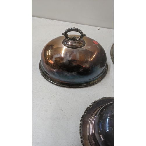 438 - Late 19th/early 20th century silver plate to include two meat covers and a butter dish Location:LWB
... 