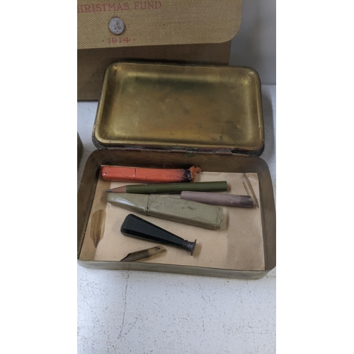 441 - Two WWI Christmas tins and Christmas Fund wallet, one other item and a stamp Location:LAM
If there i... 