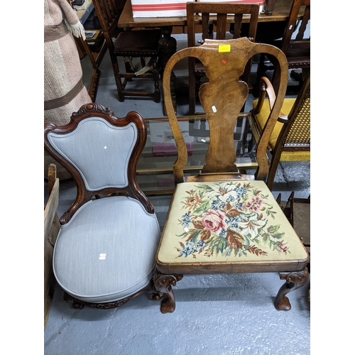 452 - A Victorian mahogany nursing chair with upholstered seat and back on carved short cabriole legs, por... 