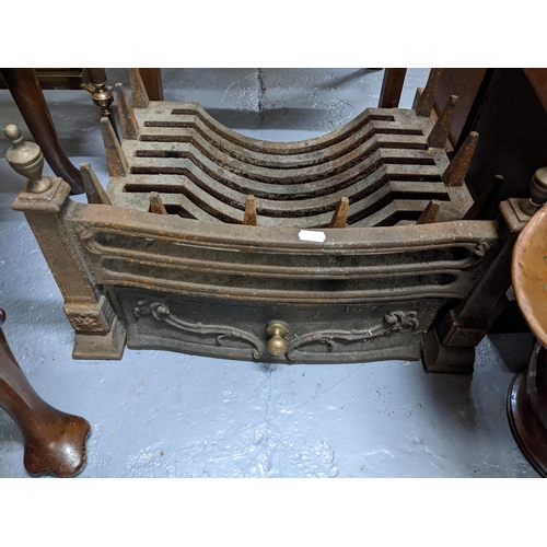 453 - An iron fire grate, Victorian copper coal scuttle and a wooden spirit level Location:G
If there is n... 