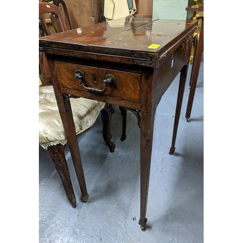 455 - A George III mahogany ladies work table, fold over top resting on pull-out loppers, embroidered fabr... 