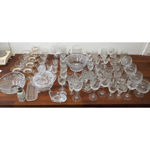 457 - A collection of glassware to include crystal cut glass, brandy glasses, wine glasses, bowls, sherry ... 