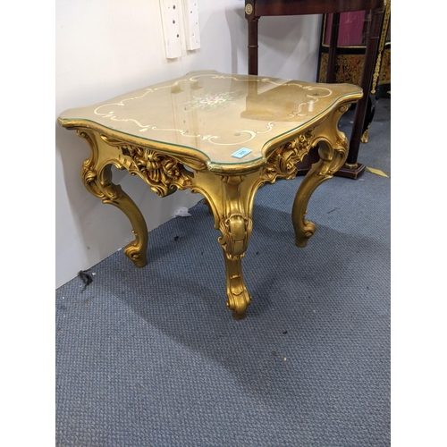 494 - A pair of modern painted gold French style side table with a glass top and floral design to the top ... 