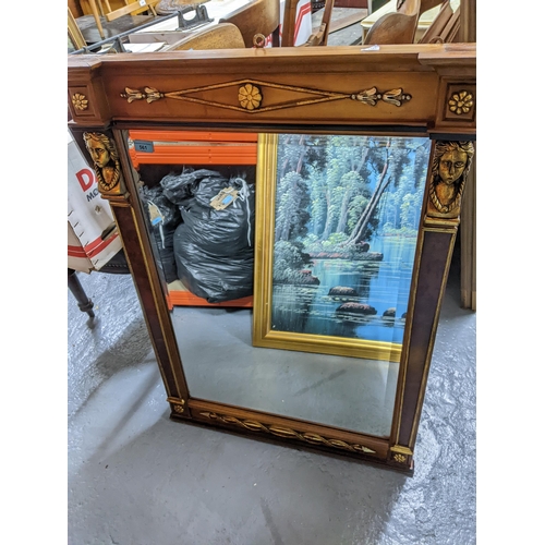 496 - An Italian wooden framed pier mirror with patera and arrow decoration highlighted in gilt, the recta... 