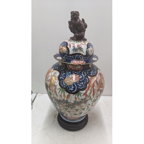 542 - A 19th century Japanese Imari covered vase on wooden stand with lion dog finial A/F
Location: LWB
If... 