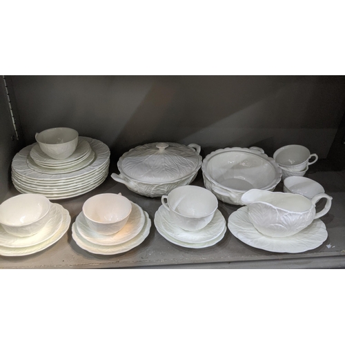 443 - Coalport white country ware leaf patterned to include a sauce boat, cups, saucers, a treen and plate... 