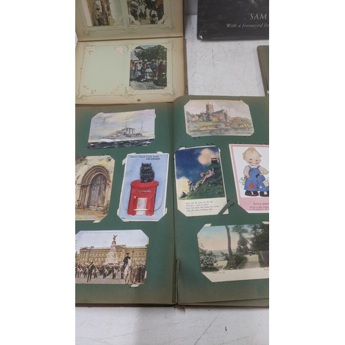 469 - A mixed lot to include three vintage postcard albums together with Fighting Ships 1750 by Sam Willis... 