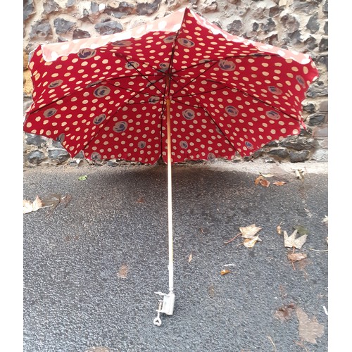 169 - A mid 20th Century large cotton tabletop parasol in red with wooden handle and metal clamp, approx 1... 