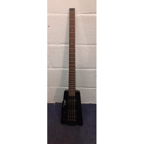 171 - A Steiberger Synapse Spirit guitar, left handed in black with padded soft case and accessories. Loca... 