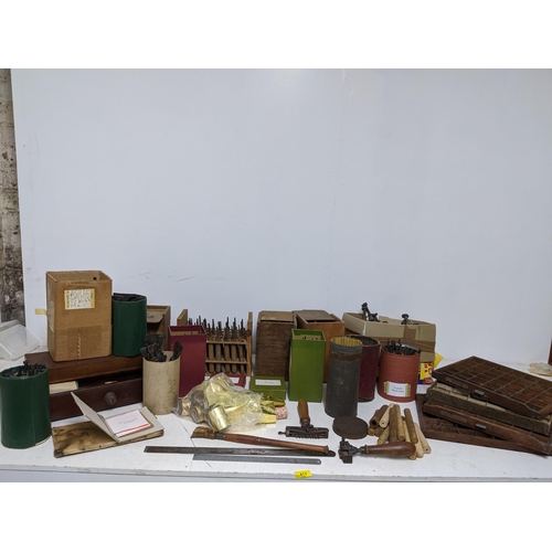 474 - A good quantity of bookbinders and printers tools, letters and other accessories to include 22 carat... 