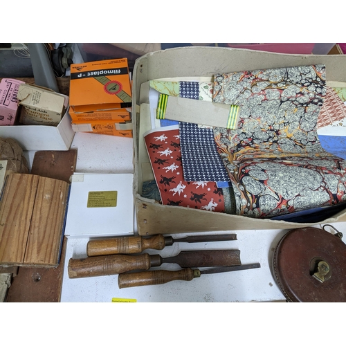 475 - A selection of bookbinders materials and accessories to include book, cloths, stain cords, headbands... 