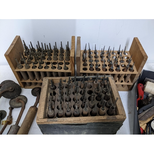 476 - A selection of bookbinders/printers tools, letter stamps and accessories tools, along with a paper c... 