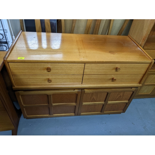 538 - A Nathan mid century teak side cabinet with four short drawers above twin cupboard doors with rectan... 