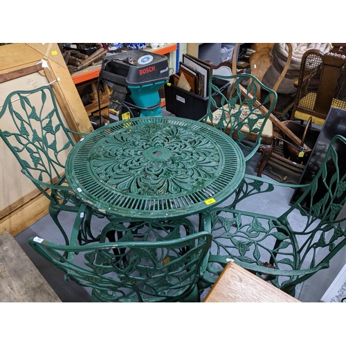 539 - A green painted cast metal garden table and four chairs Location:G
If there is no condition report s... 