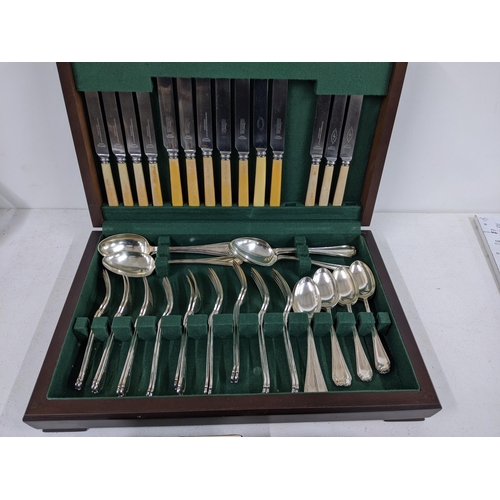 511 - A Mappin & Webb canteen of cutlery (not complete) together with an oval shaped silver plated hinged ... 