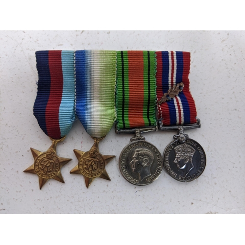 515 - WW2 medals to include the 1939-1945 Star, the Atlantic Star, the Defence Medal, and the Victory Meda... 