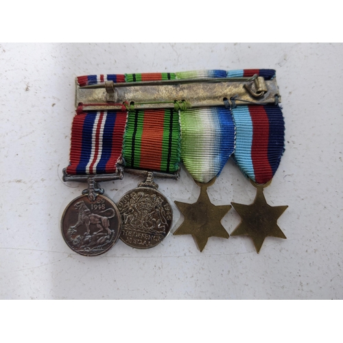 515 - WW2 medals to include the 1939-1945 Star, the Atlantic Star, the Defence Medal, and the Victory Meda... 