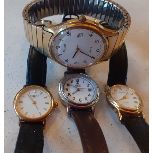 50 - Four watches comprising a ladies gold tone Tissot on black leather strap, a ladies gold tone Accuris... 