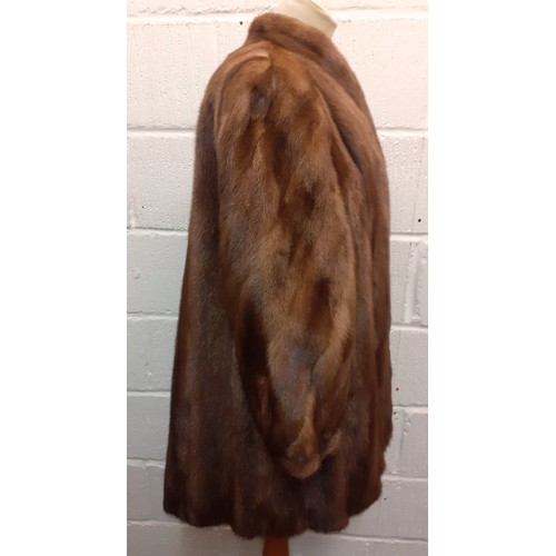 52 - A late 1970's/early '80's Saga brown mink hip length coat having bellow sleeves by JW Scott Furriers... 