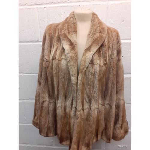 52 - A late 1970's/early '80's Saga brown mink hip length coat having bellow sleeves by JW Scott Furriers... 