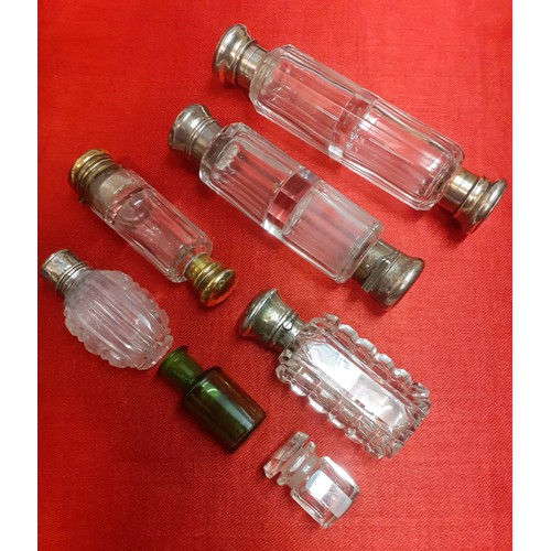 57 - A small group of 7 vintage dressing table glass scent bottles, 3 double-ended and some with white me... 