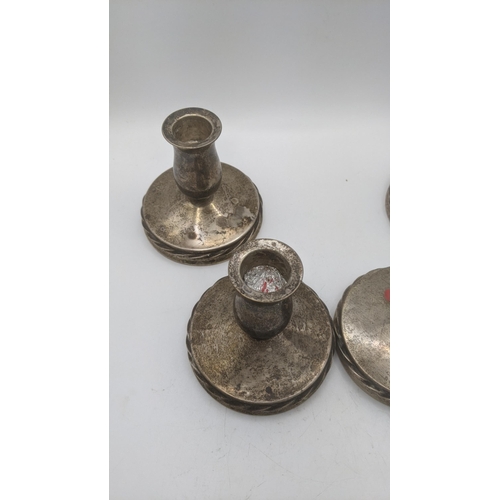 117 - Four sterling silver dwarf candlesticks, weighted Location:BWR
If there is no condition report shown... 