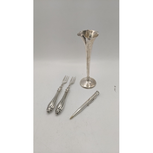 120 - Silver to include a tulip vase weighted, 13.5cm h, together with two pickle forks and a Yard O Led p... 