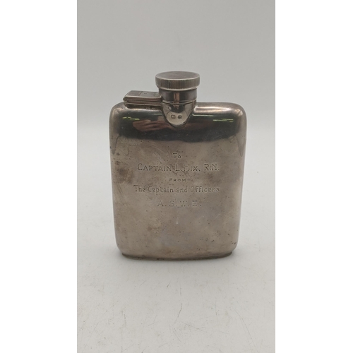 126 - A silver pocket whisky flask engraved to Captain L Hix RN from the Captain and Officers ASWE, 115.4g... 