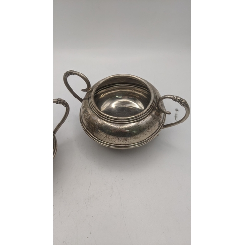 130 - An Alex Clark twin handled sugar bowl and cream jug, total weight 207g Location:RWB
If there is no c... 