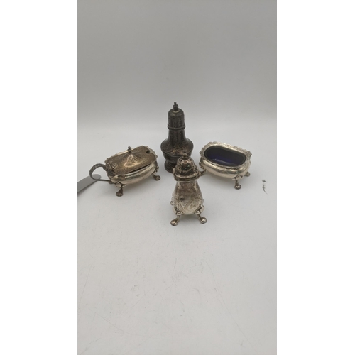 133 - Mixed silver to include two pepper pots, two condiment pots and 12 silver handled butter knives Loca... 