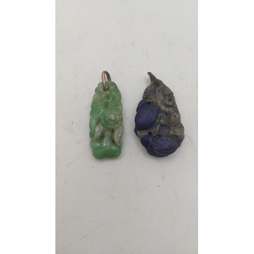 139 - A jade albite floral carved pendant, along with a carved lapis lazuli pendant Location:CAB5
If there... 