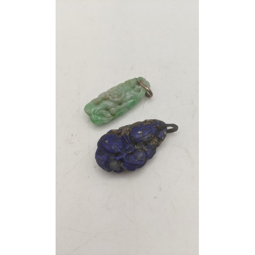 139 - A jade albite floral carved pendant, along with a carved lapis lazuli pendant Location:CAB5
If there... 