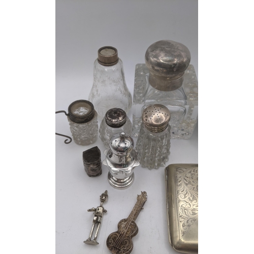 144 - Mixed silver white metal items to include a miniature chair and others, together with an embossed pi... 