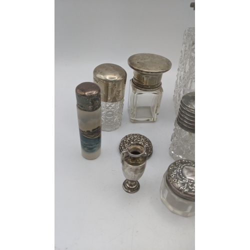 153 - A mixed lot of silver and crystal cut glass scent bottles and dressing table jars, together with a p... 