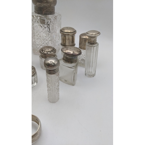 153 - A mixed lot of silver and crystal cut glass scent bottles and dressing table jars, together with a p... 