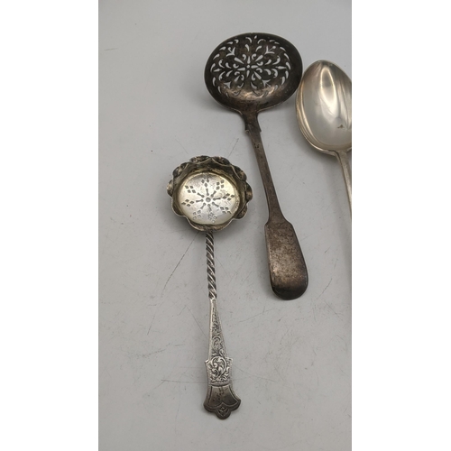 163 - Silver to include two sugar sifters and a pair of Kemp Brothers table spoons, hallmarked London 1935... 