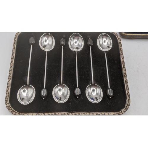 167 - Two sets of six silver coffee spoons to include one set hallmarked London 1909, both in fitted cases... 